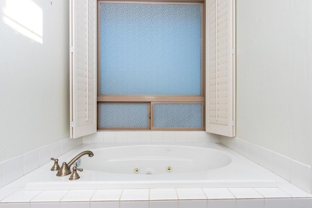 bathroom featuring tiled bath