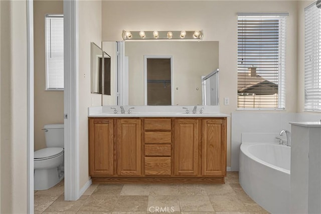 full bathroom with shower with separate bathtub, vanity, and toilet