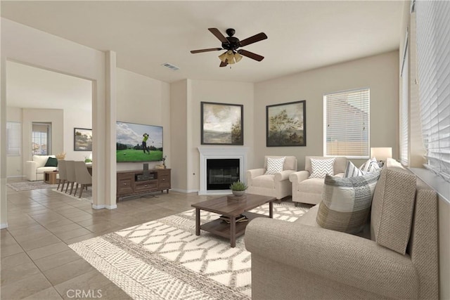 living room featuring light tile patterned floors and ceiling fan