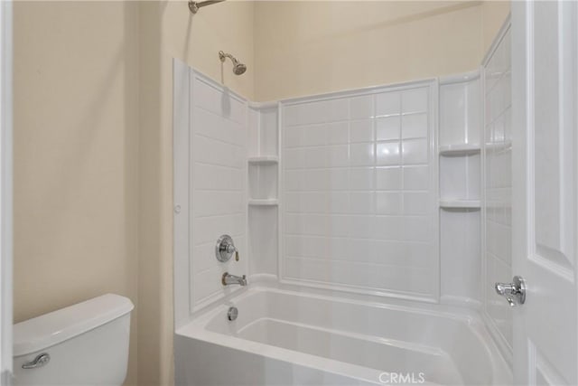 bathroom with toilet and bathing tub / shower combination