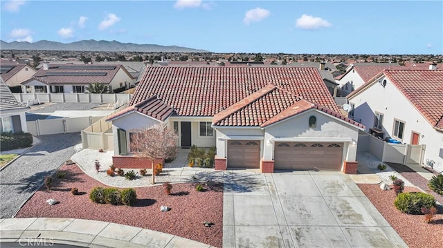 birds eye view of property featuring a mountain view