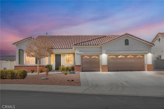 mediterranean / spanish-style home featuring a garage