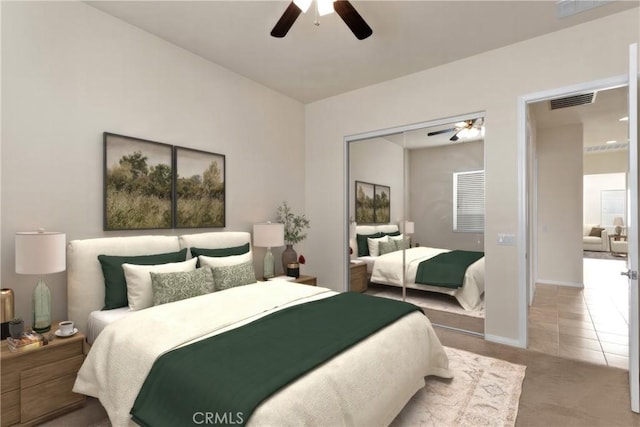 tiled bedroom with ceiling fan and a closet