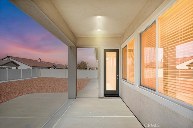 view of patio terrace at dusk