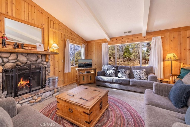 living room featuring a fireplace, lofted ceiling with beams, and wood walls