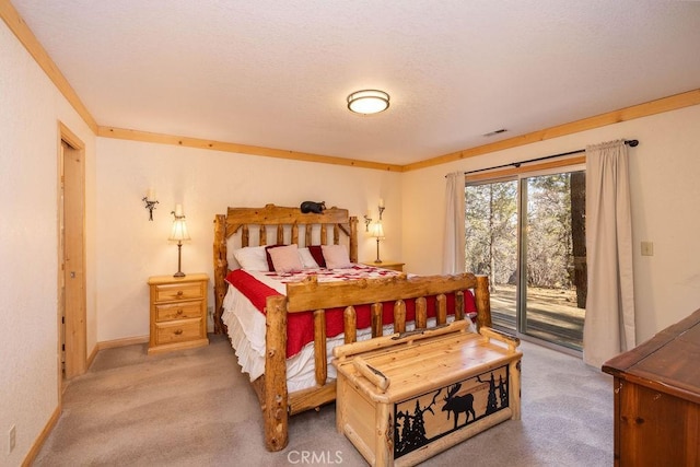 bedroom with access to outside, light colored carpet, and a textured ceiling