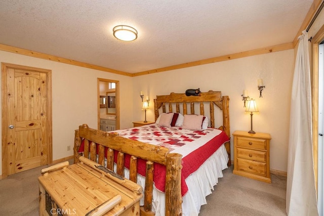 carpeted bedroom featuring a textured ceiling and connected bathroom