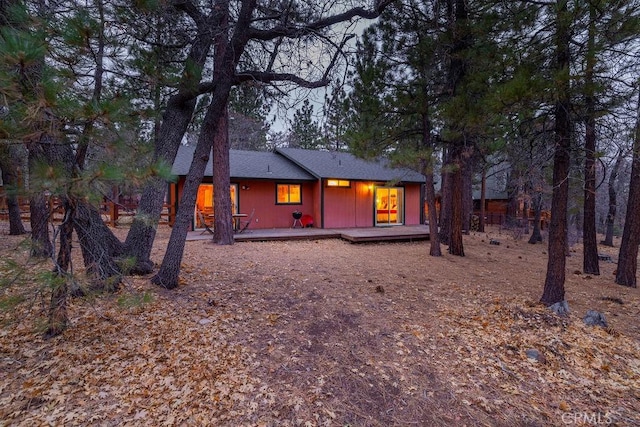 rear view of property with a wooden deck