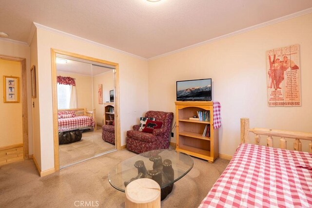 bedroom featuring light carpet, a closet, and ornamental molding