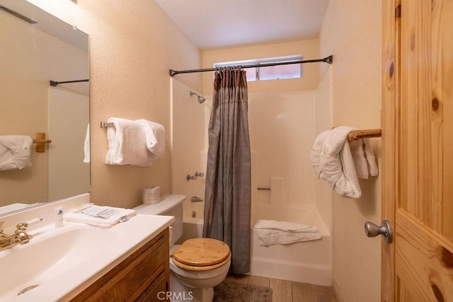 full bathroom with shower / bath combination with curtain, vanity, and toilet