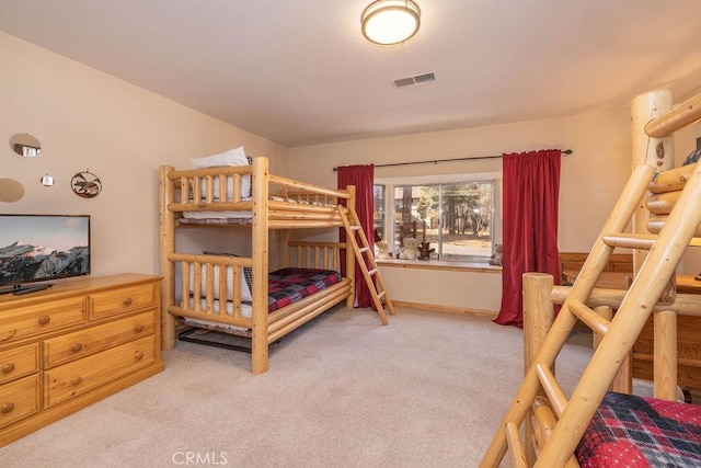 bedroom featuring light carpet