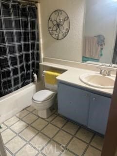 full bathroom featuring toilet, vanity, tile patterned flooring, and tub / shower combination