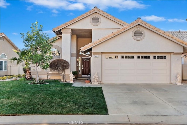 view of front of home featuring a front lawn and a garage