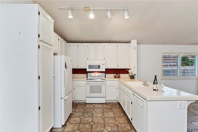 kitchen featuring white cabinetry, sink, kitchen peninsula, and white appliances