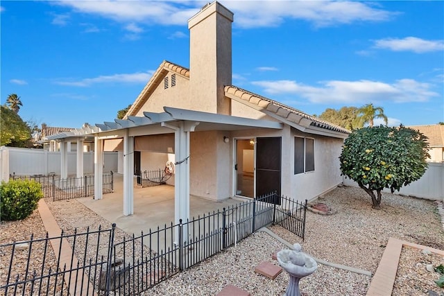 rear view of house with a patio area