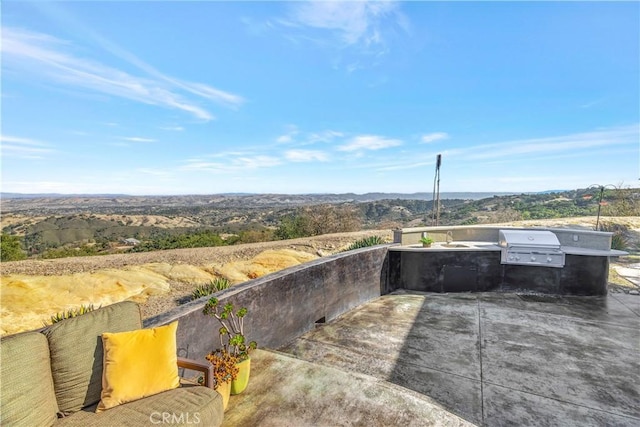 view of patio / terrace featuring sink, area for grilling, and exterior kitchen