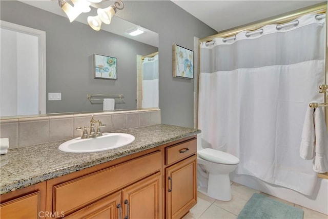 full bathroom with tile patterned flooring, vanity, shower / bath combination with curtain, and toilet