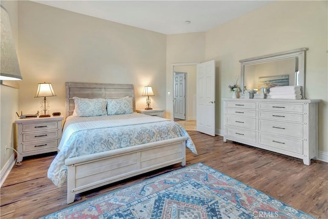 bedroom with hardwood / wood-style flooring