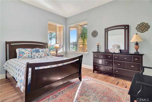 bedroom with light hardwood / wood-style floors