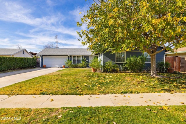 view of front facade featuring a garage and a front yard