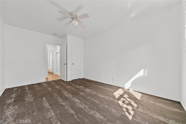 unfurnished bedroom featuring carpet flooring and ceiling fan