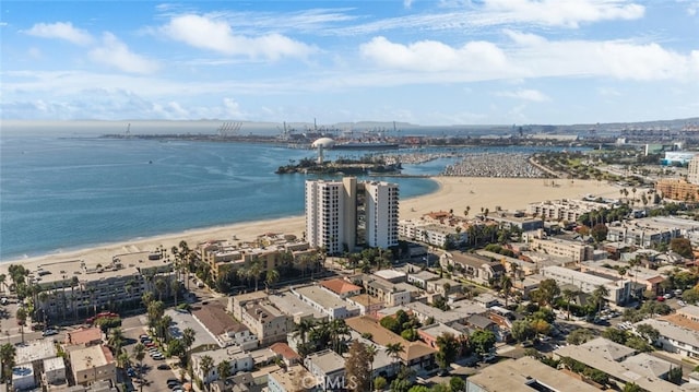 aerial view with a water view and a view of the beach