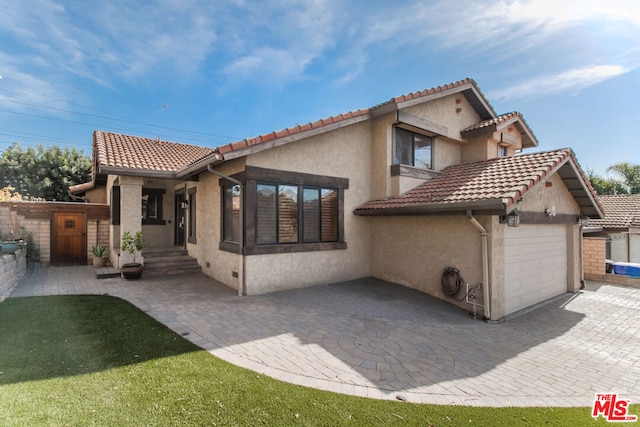 view of front of home featuring a garage