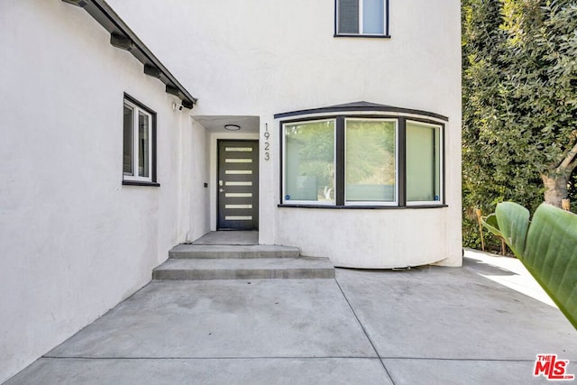 entrance to property with a patio