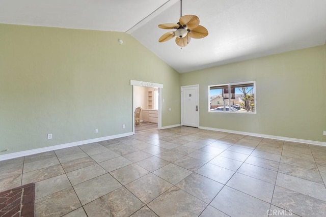 tiled spare room with high vaulted ceiling, baseboards, and a ceiling fan