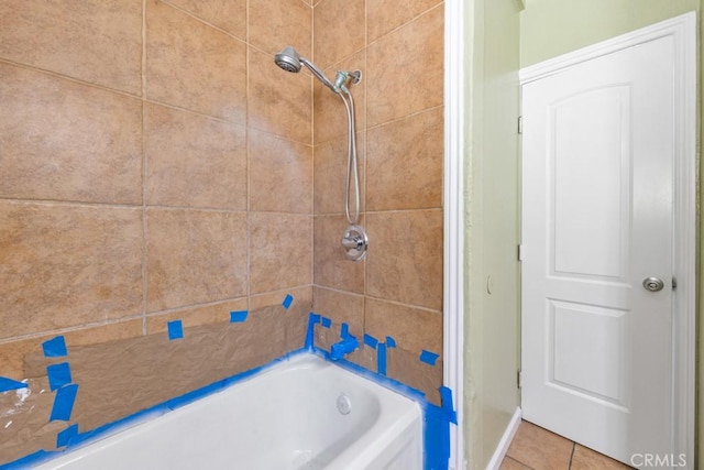 bathroom with bathing tub / shower combination and tile patterned flooring