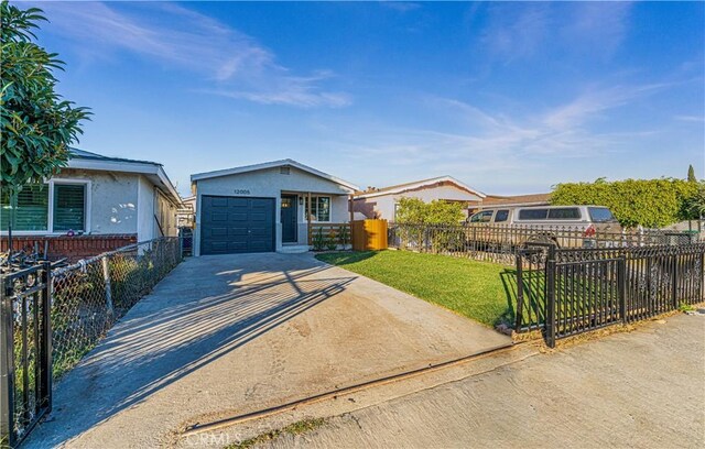 view of front facade with a garage and a front lawn