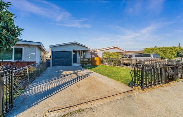 view of front of house with a garage and a front lawn