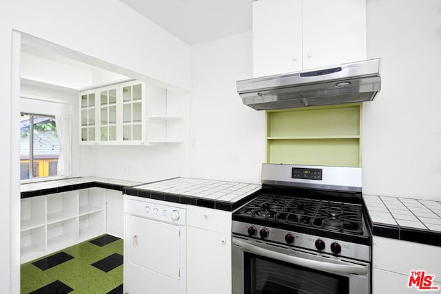 kitchen featuring tile countertops, white cabinetry, and stainless steel range with gas stovetop