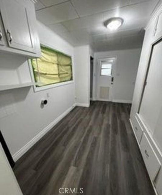 laundry area featuring dark hardwood / wood-style flooring