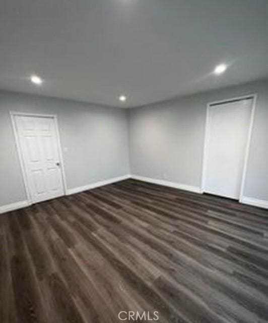 basement with dark wood-type flooring