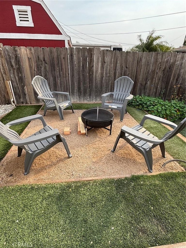 view of patio / terrace featuring an outdoor fire pit