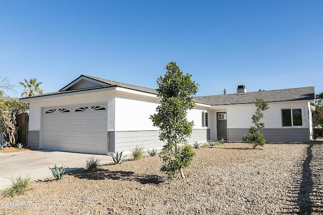 ranch-style house featuring a garage