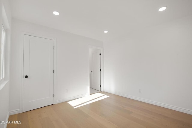 unfurnished bedroom featuring light wood-type flooring