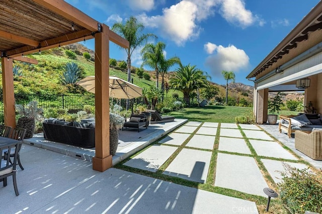 view of patio with an outdoor hangout area and a mountain view