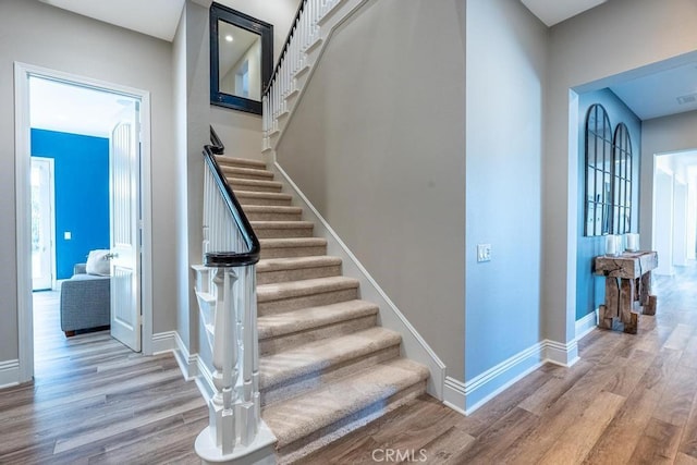 stairs with wood-type flooring