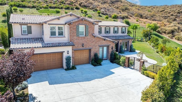 mediterranean / spanish-style home featuring a garage