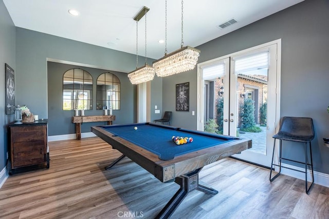 rec room featuring a notable chandelier, french doors, billiards, and hardwood / wood-style flooring