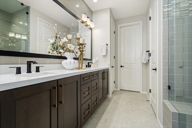 bathroom featuring vanity and a shower with shower door