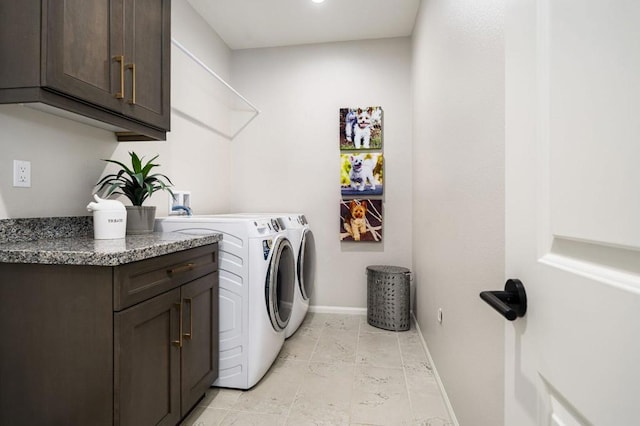 laundry area featuring cabinets and washer and dryer