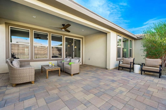 view of patio with outdoor lounge area and ceiling fan