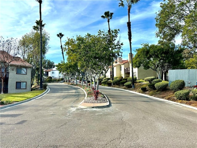 view of road featuring curbs and a residential view