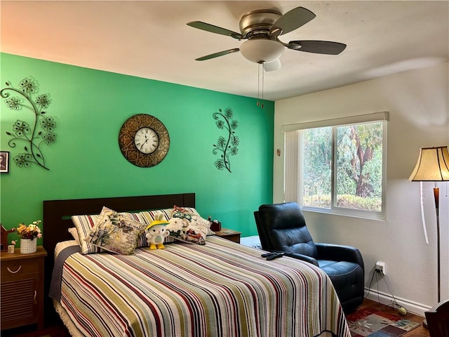 bedroom featuring a ceiling fan and baseboards