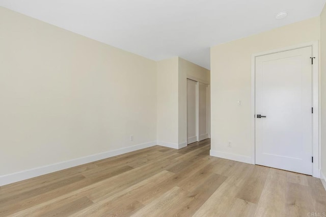 empty room with light hardwood / wood-style floors