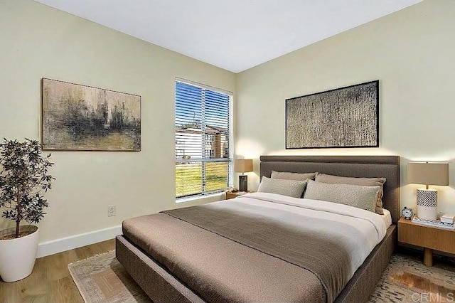 bedroom with hardwood / wood-style floors