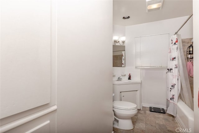 full bathroom featuring toilet, sink, and shower / tub combo with curtain